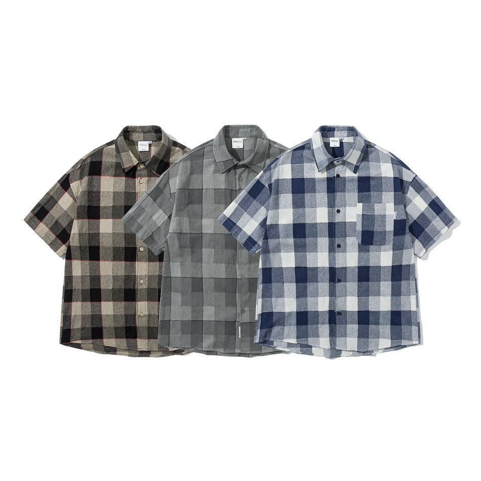 Three short-sleeve button-up shirts shown from the front in brown, gray, and blue checks.