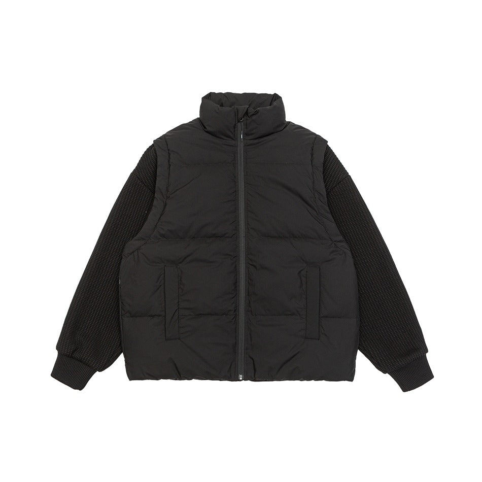 Black quilted puffer jacket with stand collar, front zipper, pockets and ribbed knit sleeves with ribbed cuffs