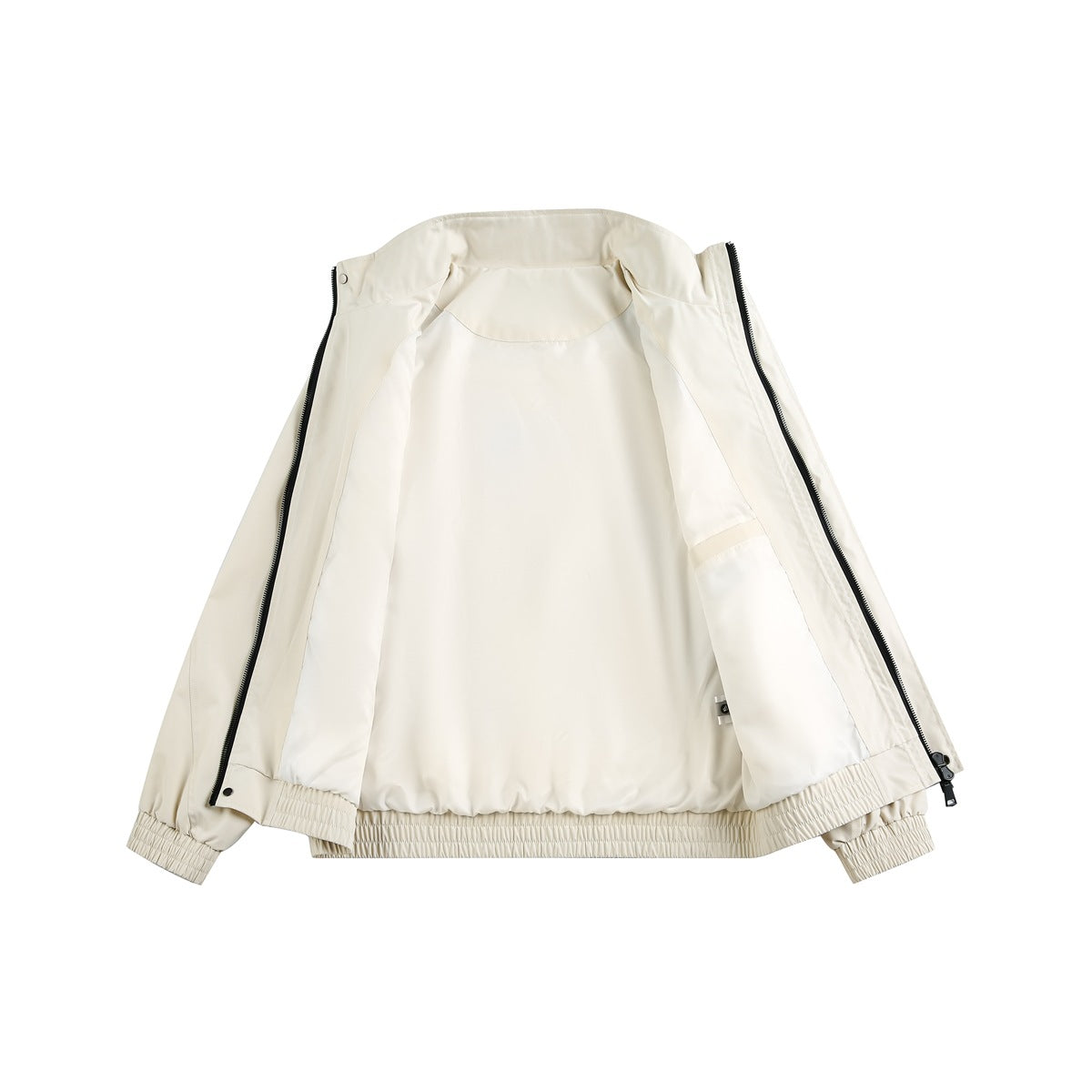Cream jacket opened flat to show its light-colored inner lining, zipper, and elasticated hem and cuffs.