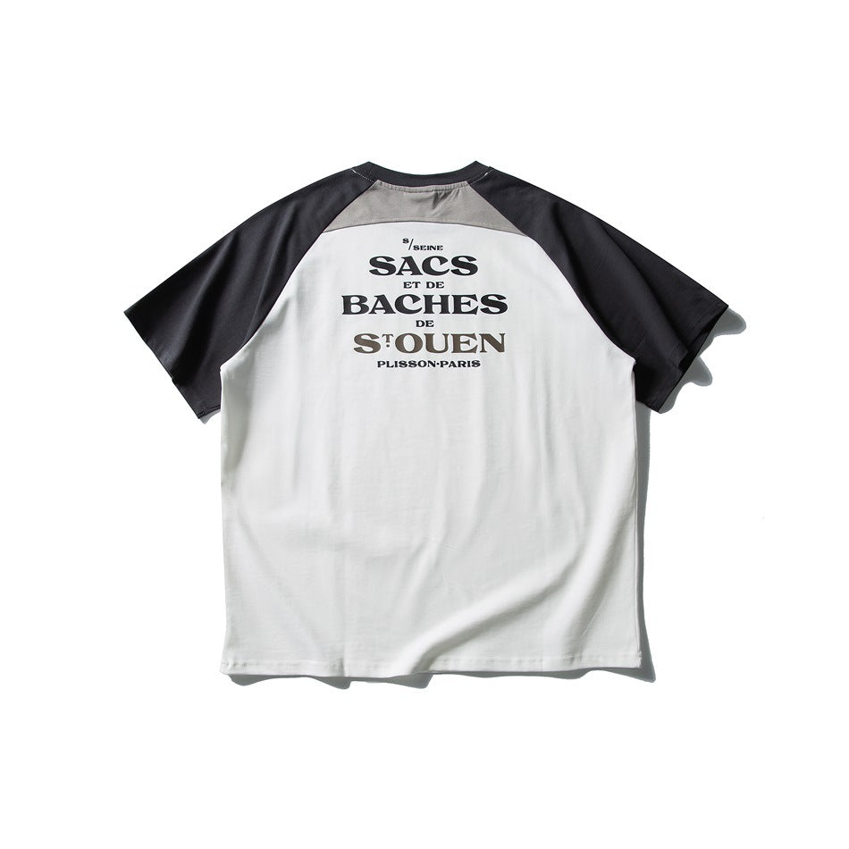 Back of white raglan T-shirt with dark gray sleeves, gray shoulder panel and black serif text graphic