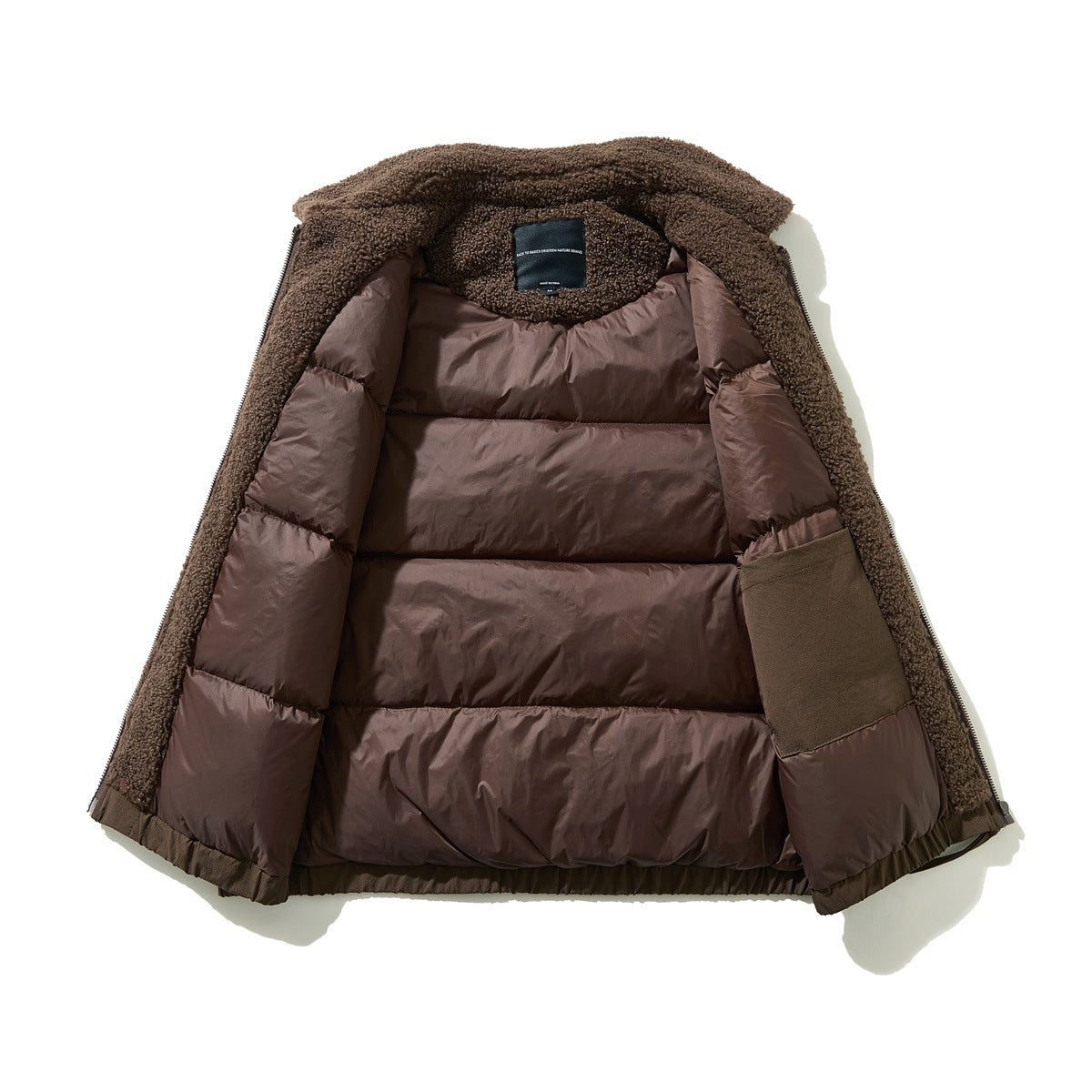 Open brown jacket showing its quilted lining, curly fleece collar and inner sleeve panel.