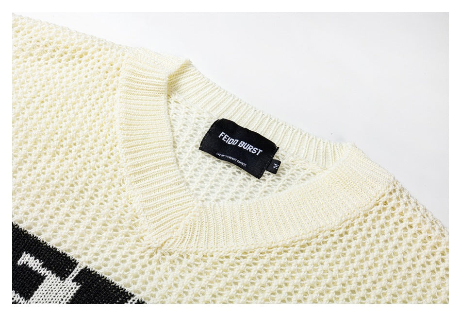 Close-up of the ivory knit V-neck and inner FEIDD BURST label, with a small size M tag.