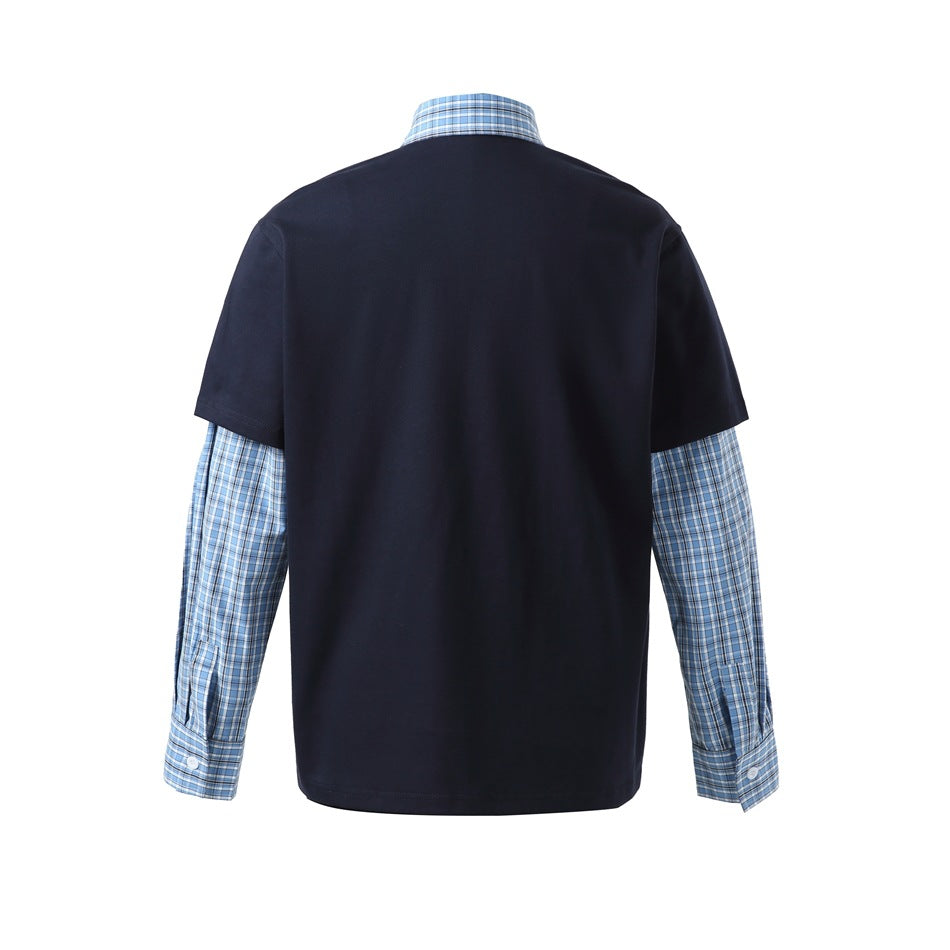 Back view of a navy short-sleeve polo layered over blue plaid sleeves, with a plaid collar.