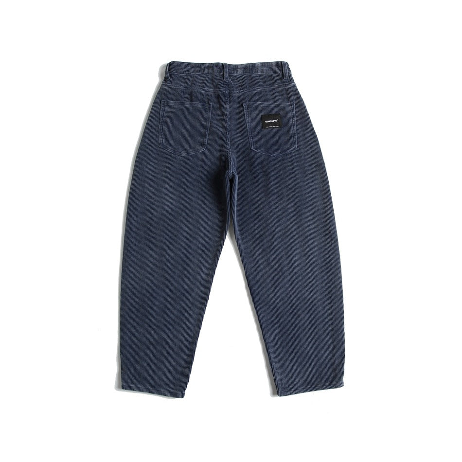 Blue wide-rib corduroy pants laid flat, back view, with two patch pockets and a small black label