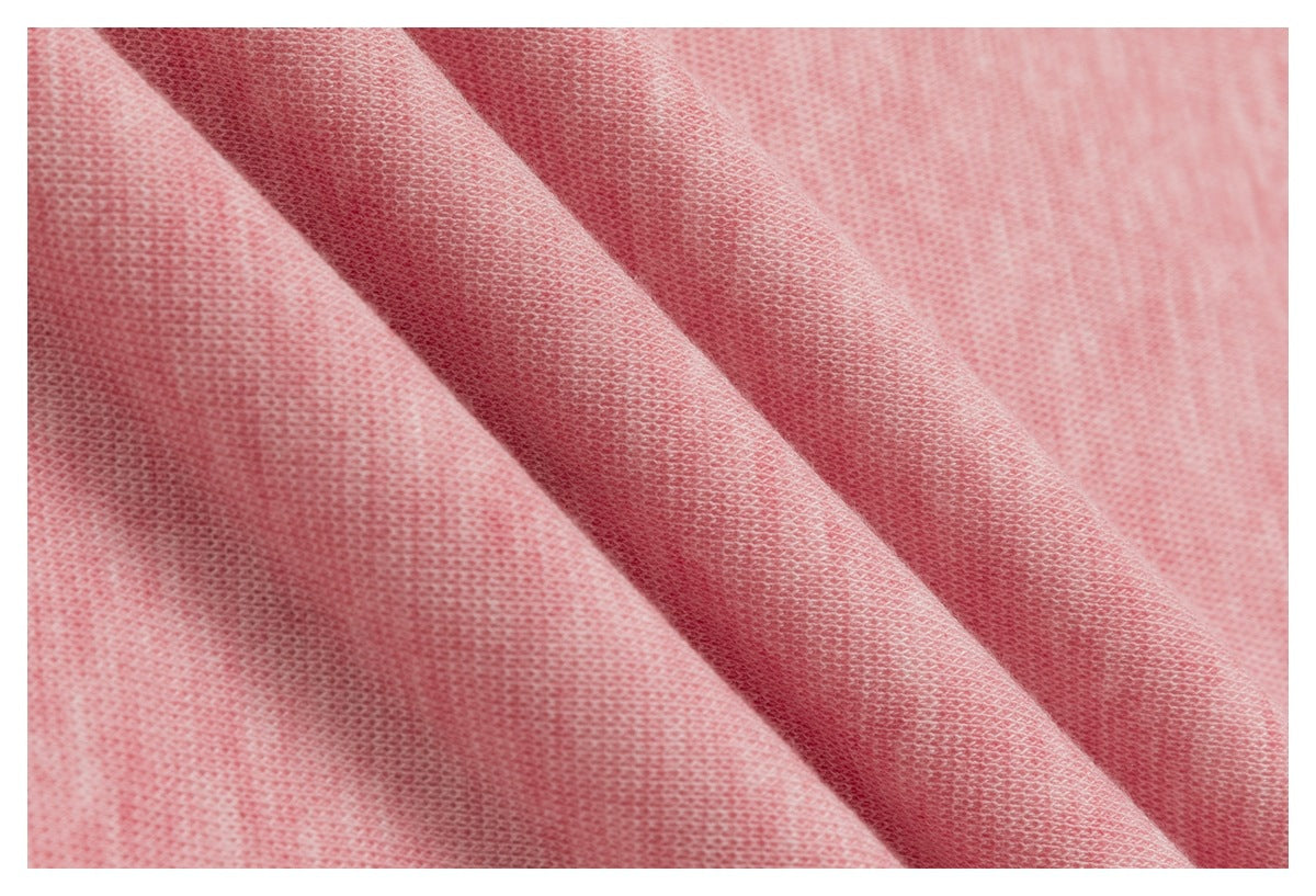 Macro view of the heather-pink knit surface and its visible loops.