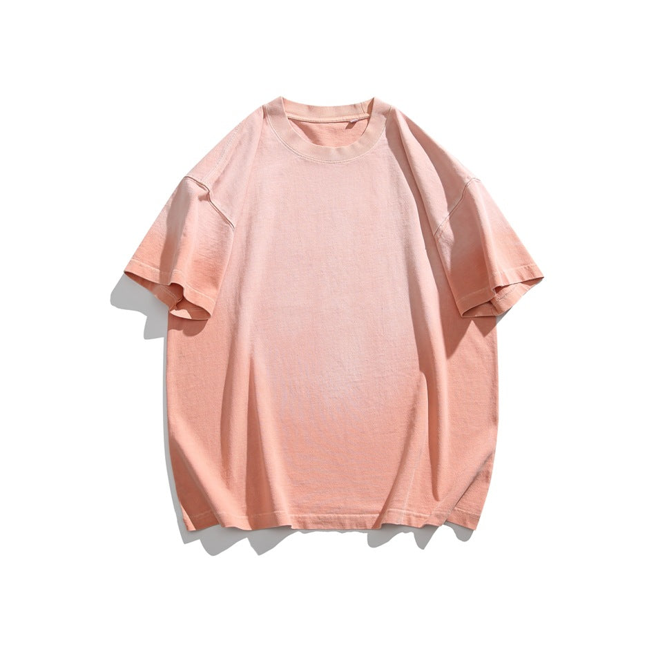 Pink short-sleeve crewneck T-shirt with peach gradient tone, flat lay front view