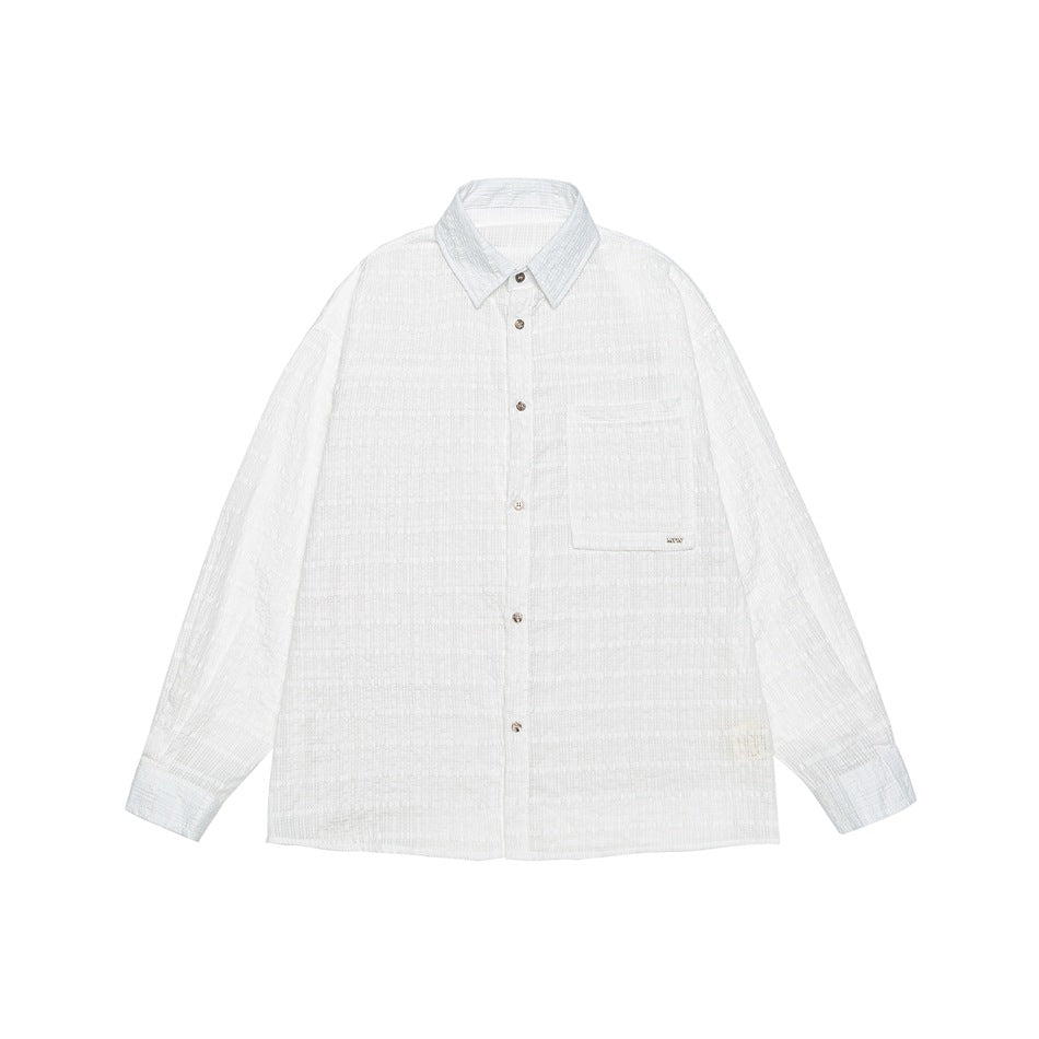 White long-sleeve button-up shirt with textured tonal check pattern, chest pocket and pointed collar, flat lay