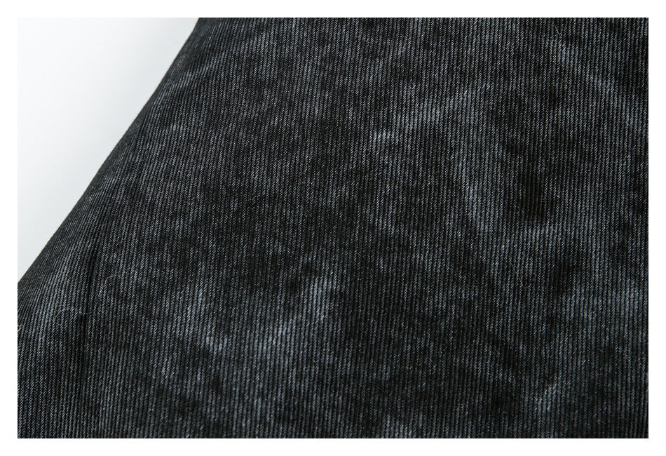Close-up showing the charcoal jacket fabric's fine dark-and-gray textured pattern.