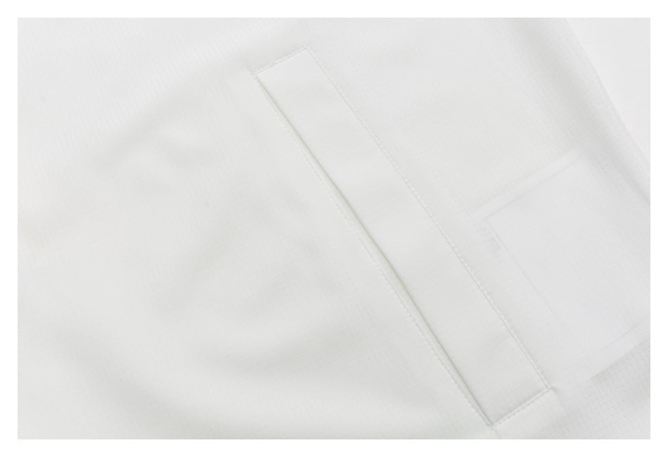 Close-up of a narrow welt pocket on white grid-textured fabric.