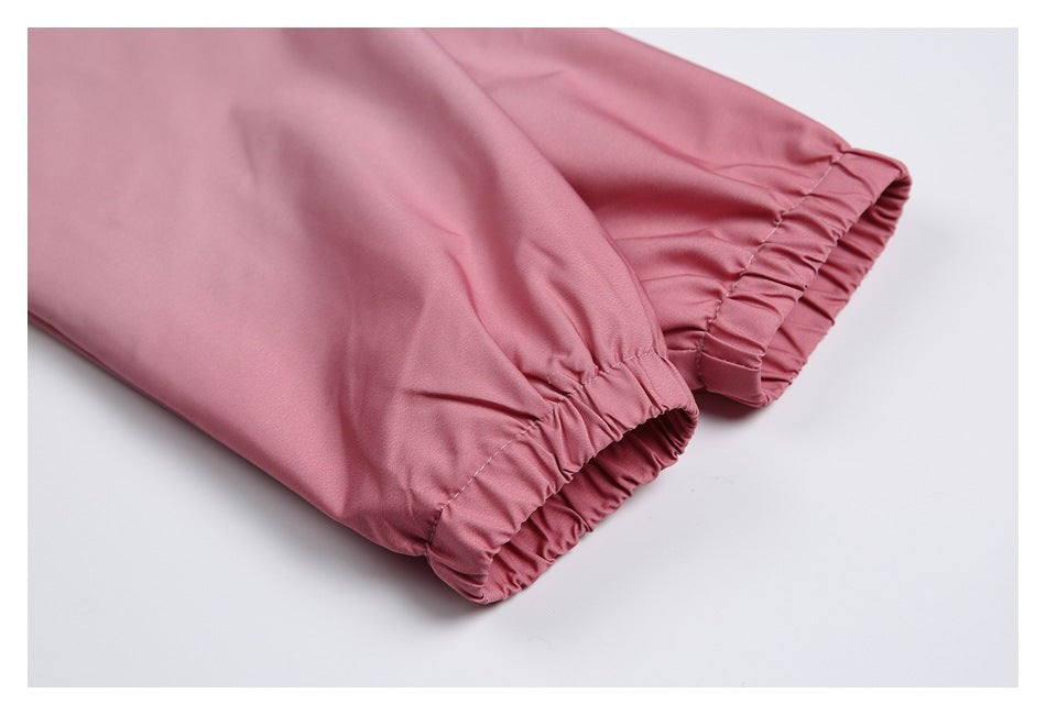 Close-up of the jacket's pink sleeves with gathered elastic cuffs.