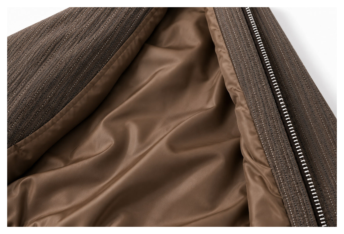 Close-up of the brown jacket's smooth lining and front zipper.