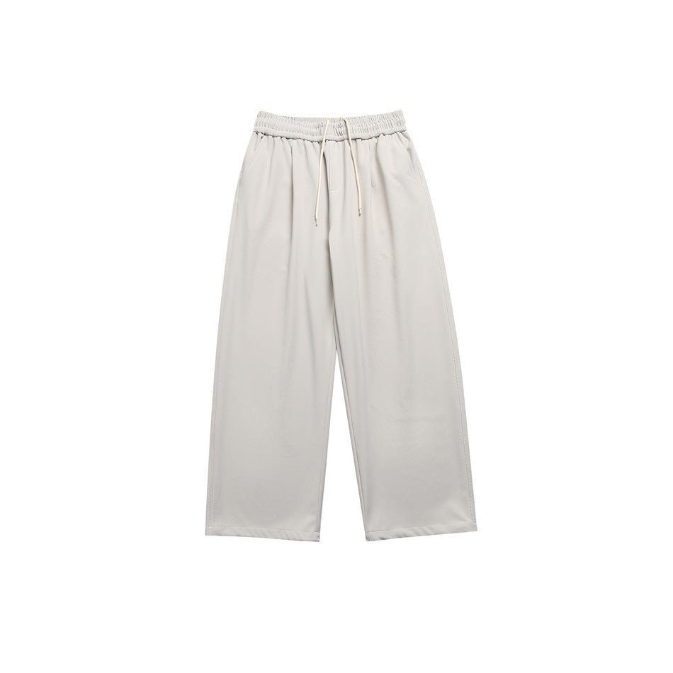 Light gray wide-leg pants with elastic drawstring waist, front pleats and side pockets, flat lay front view