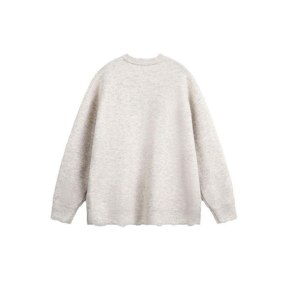 Back view of a light gray crewneck sweater with long sleeves and ribbed cuffs and hem, laid flat on white.