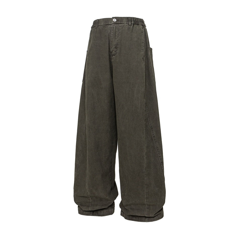 Olive green washed wide-leg pants with elastic waistband, button fly, side pocket and curved leg seams