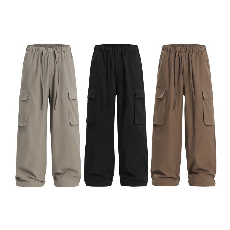 Three colorways of wide-leg cargo pants: taupe-gray, black, and brown.