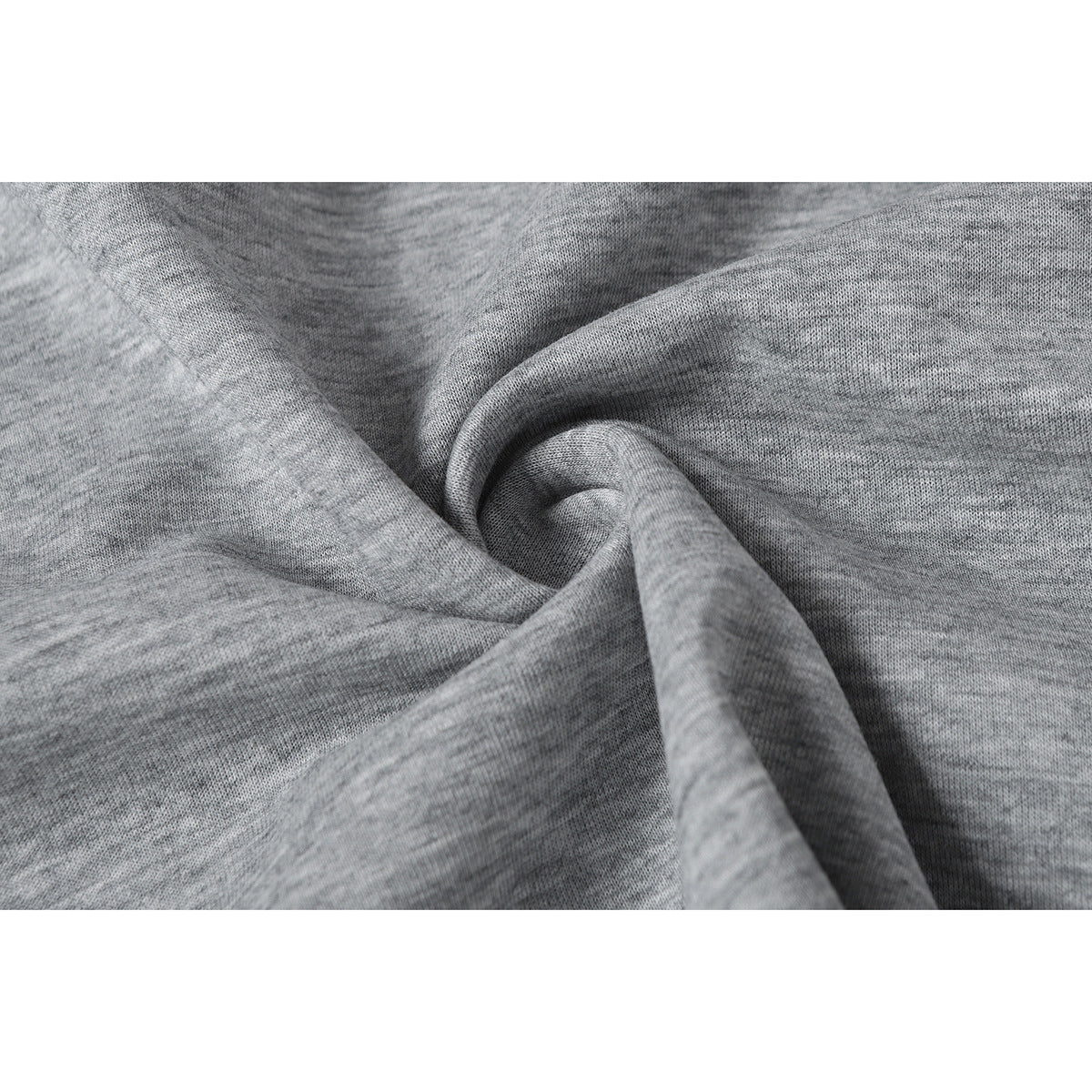 Close-up of heather gray knit fabric arranged in soft folds.