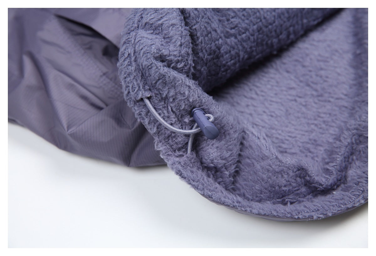 Close-up of the jacket's plush lining and an adjustable drawcord toggle at the edge.