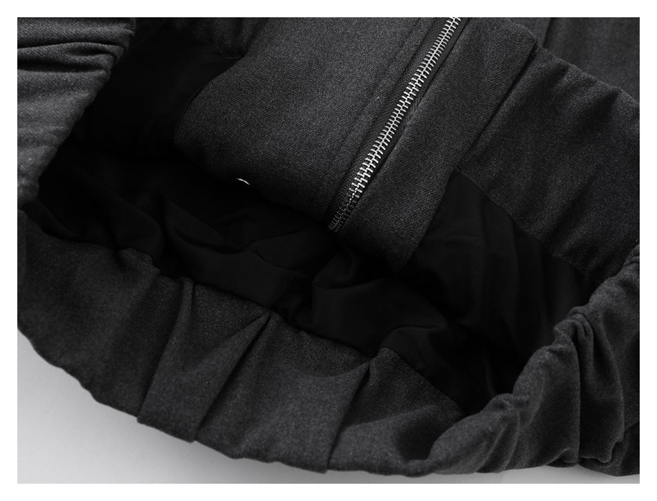 Charcoal coat opened to show the black inner lining and front zipper.