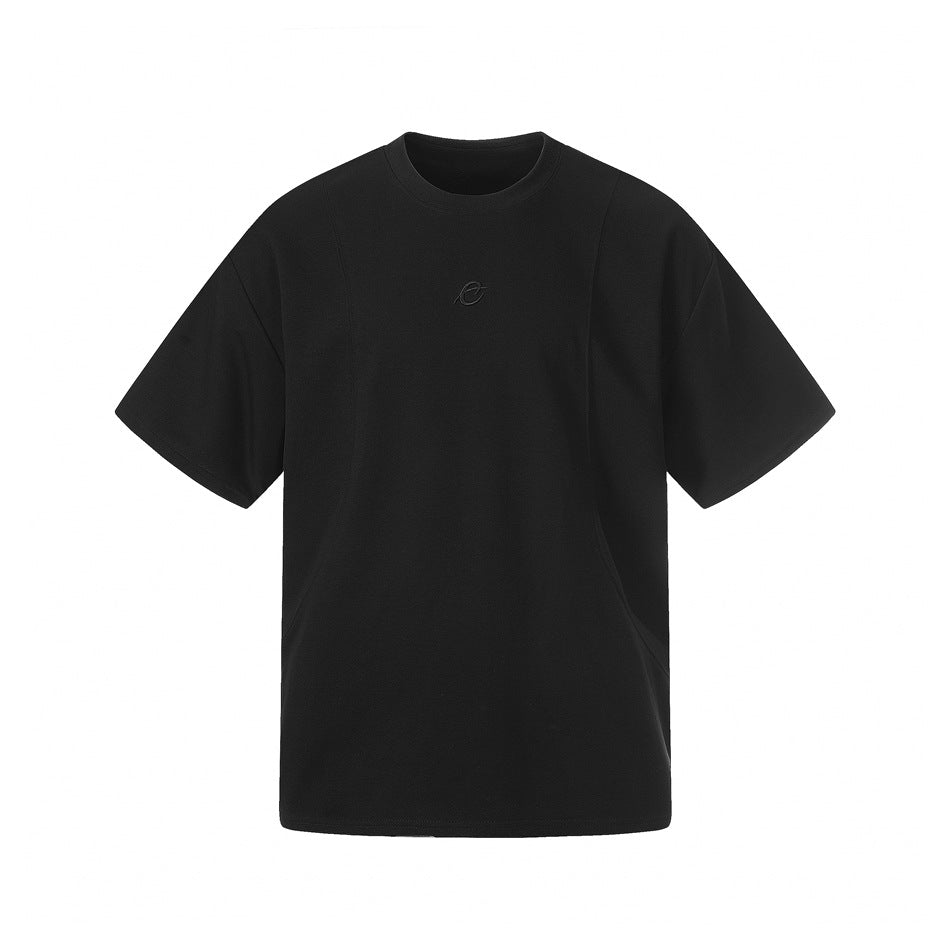 Front view of a black short-sleeve crew-neck T-shirt with a small tonal chest emblem on a white background.