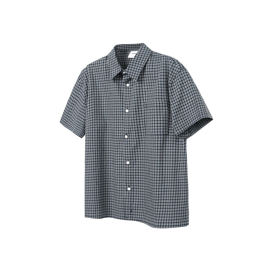 Black and white plaid short-sleeve button-front shirt with chest pocket, shown flat from the front