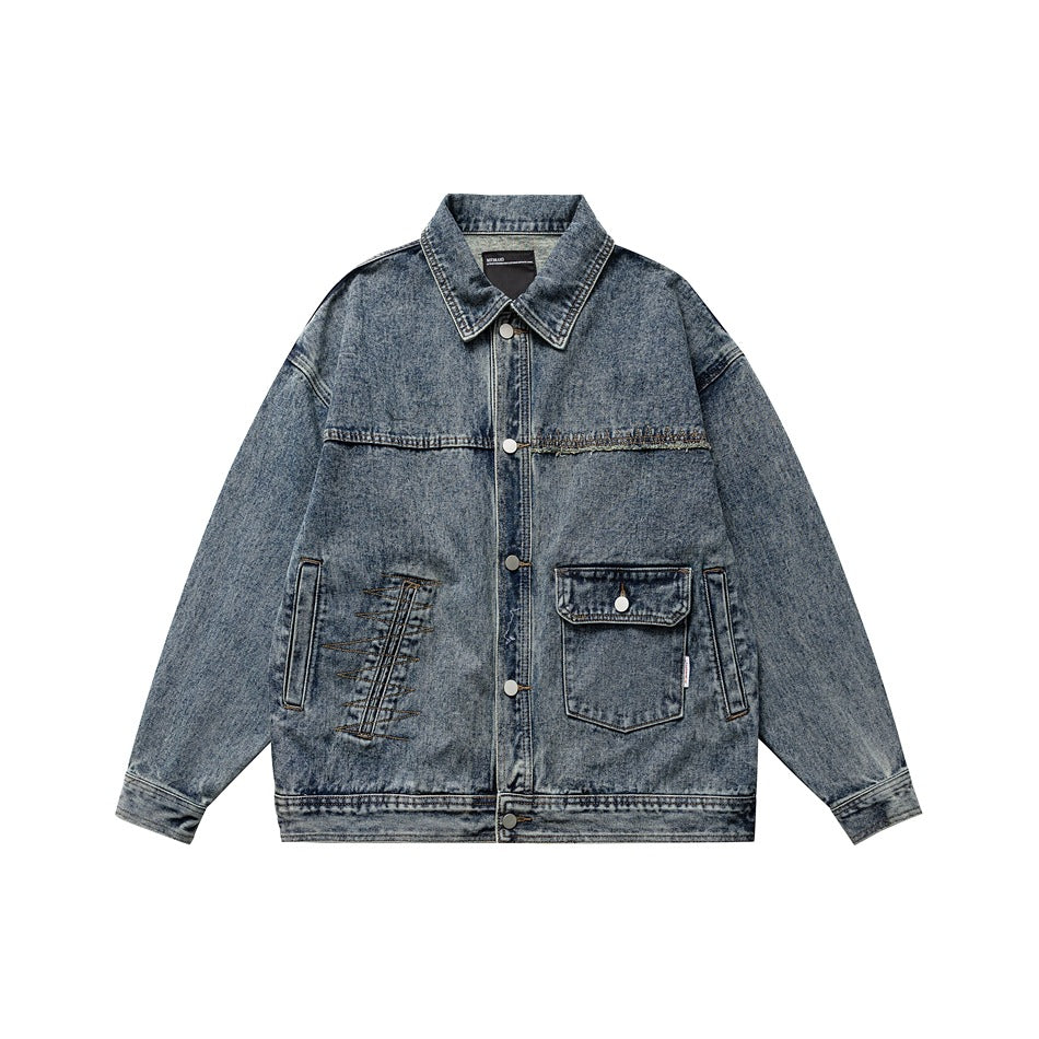 Blue washed denim jacket, front view, with collar, button front, flap chest pocket and embroidered stitch detail