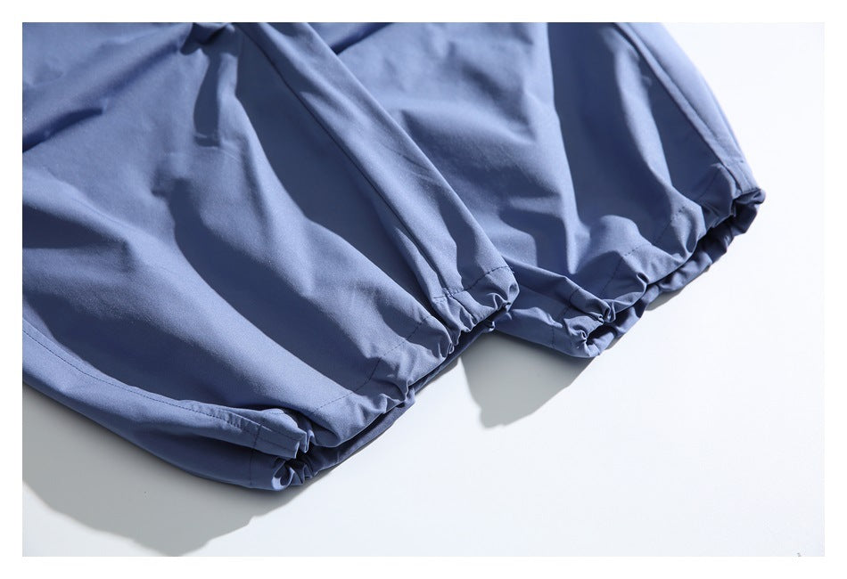Close-up of blue garment fabric with gathered elastic edges.