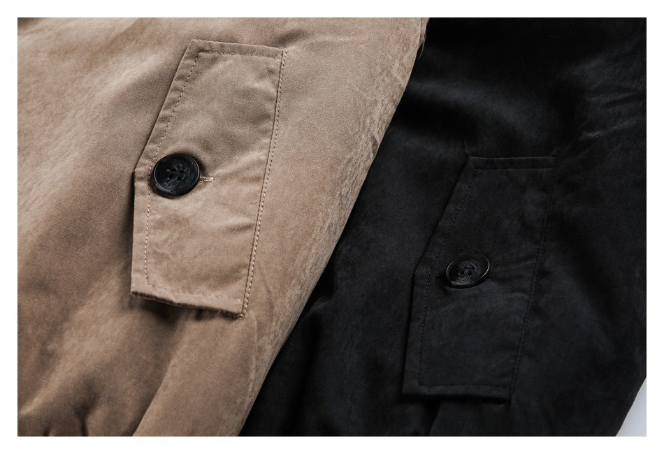 Close-up of buttoned sleeve tabs on taupe and black coats.