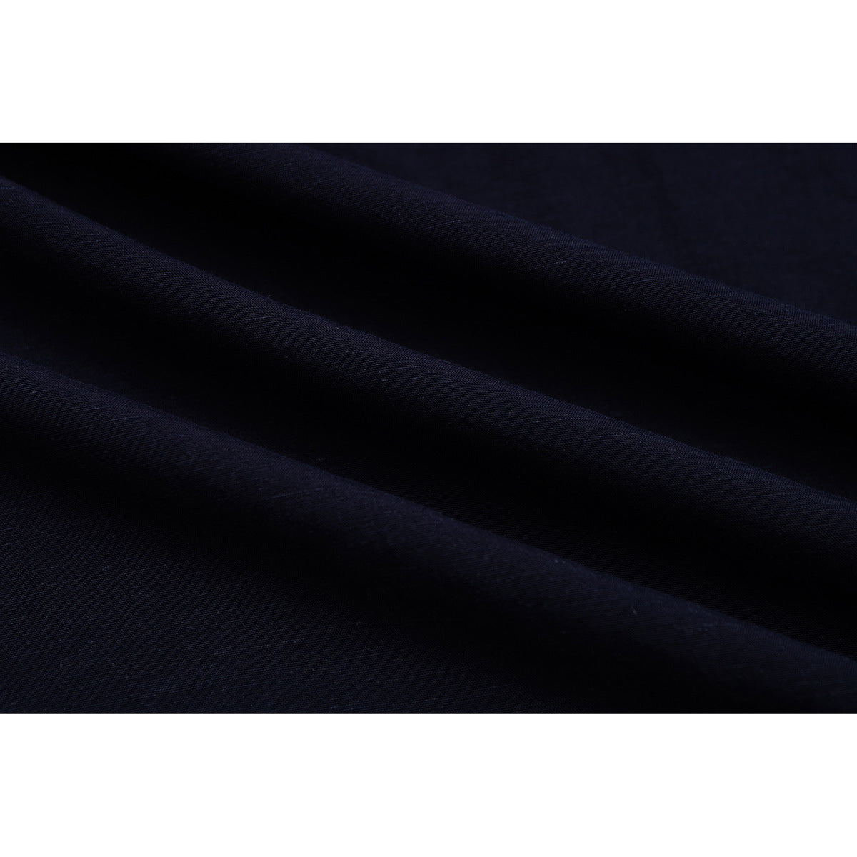 Close-up showing the dark navy fabric draped in soft folds.