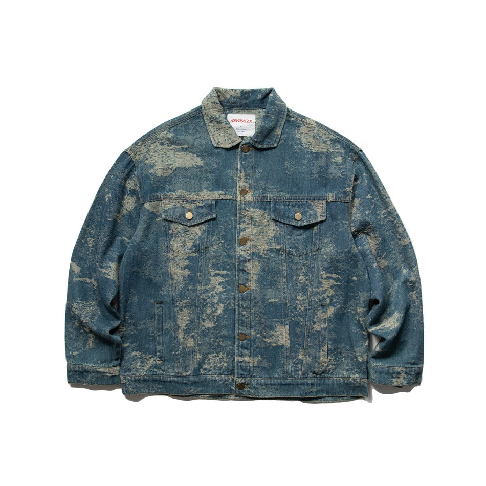 Front of blue washed denim-style trucker jacket with tan mottled pattern, chest flap pockets and button front