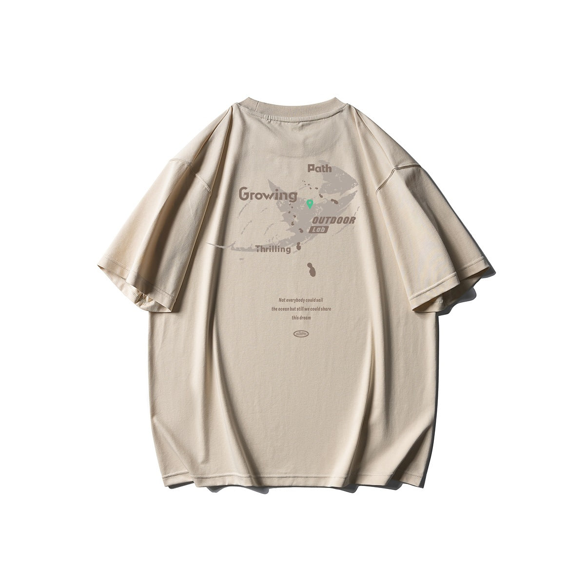 Back view of a beige oversized T-shirt with a brown outdoor-themed graphic and text.