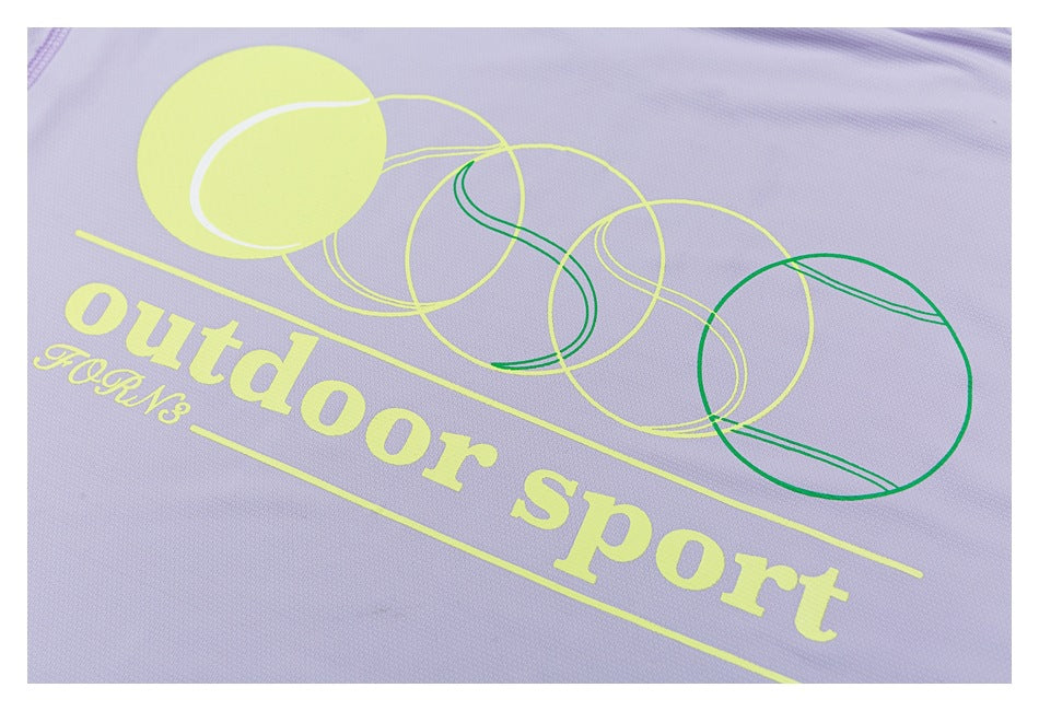 Lavender shirt detail with yellow and green circular graphics and the words “Outdoor sport.”