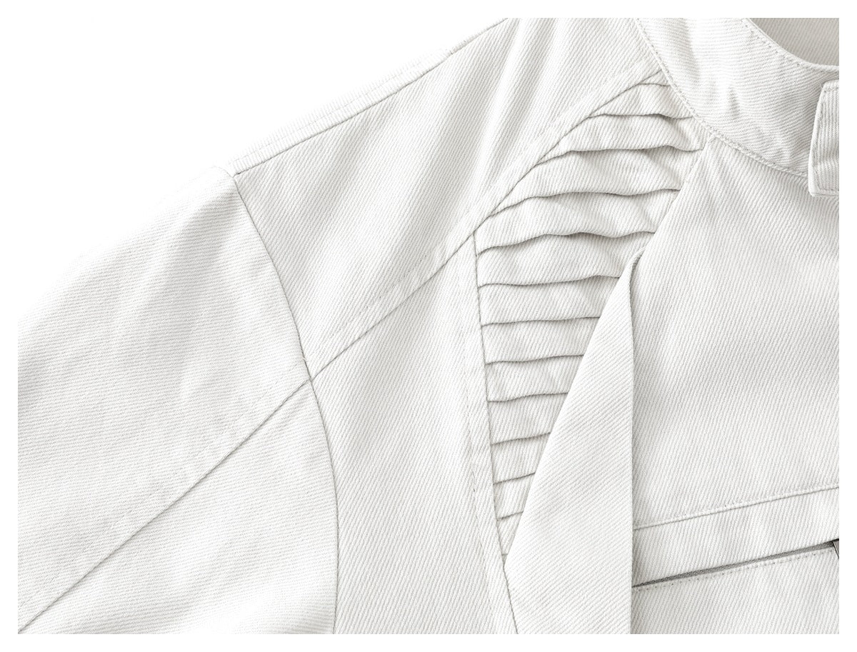 Close-up of the off-white jacket shoulder showing layered pleats and seam detailing.