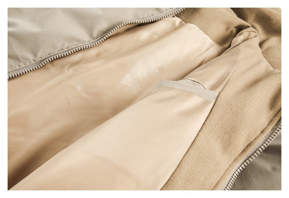 Close-up of the garment's beige interior lining, zipper, and soft-looking inner panel.