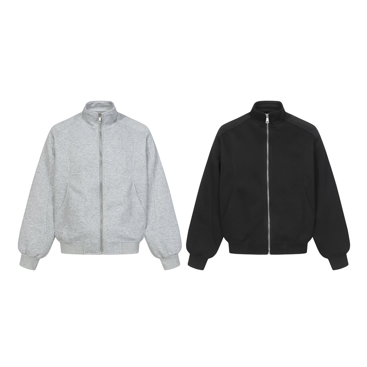 Front views of two zip-front jackets with stand collars, one light gray melange and one black.