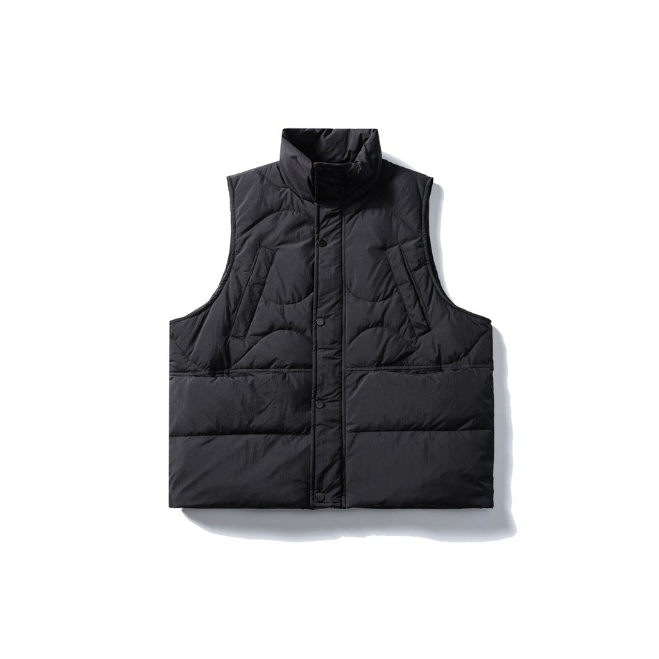 Black quilted puffer vest with stand collar and snap front placket, flat lay front view