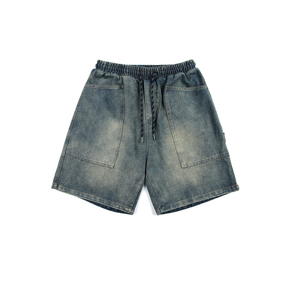 Faded blue denim shorts with elastic drawstring waist and large front patch pockets, flat lay front view