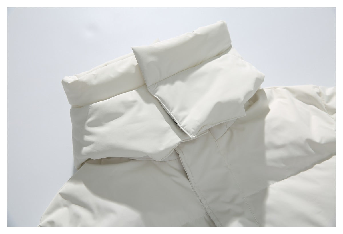 Close-up of the white coat's folded padded collar and hood construction.