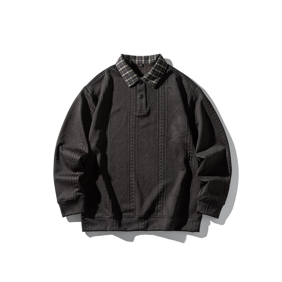 Black textured long-sleeve pullover with plaid polo collar and two-button placket, flat lay front view
