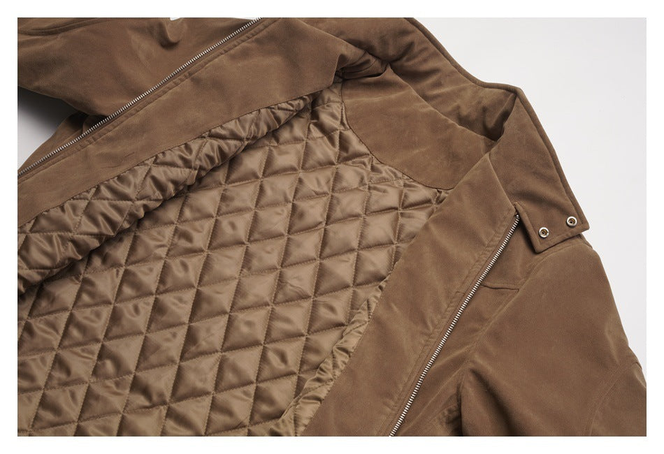 Brown jacket opened to show its diamond-quilted lining, front zipper, and snap-tab collar.