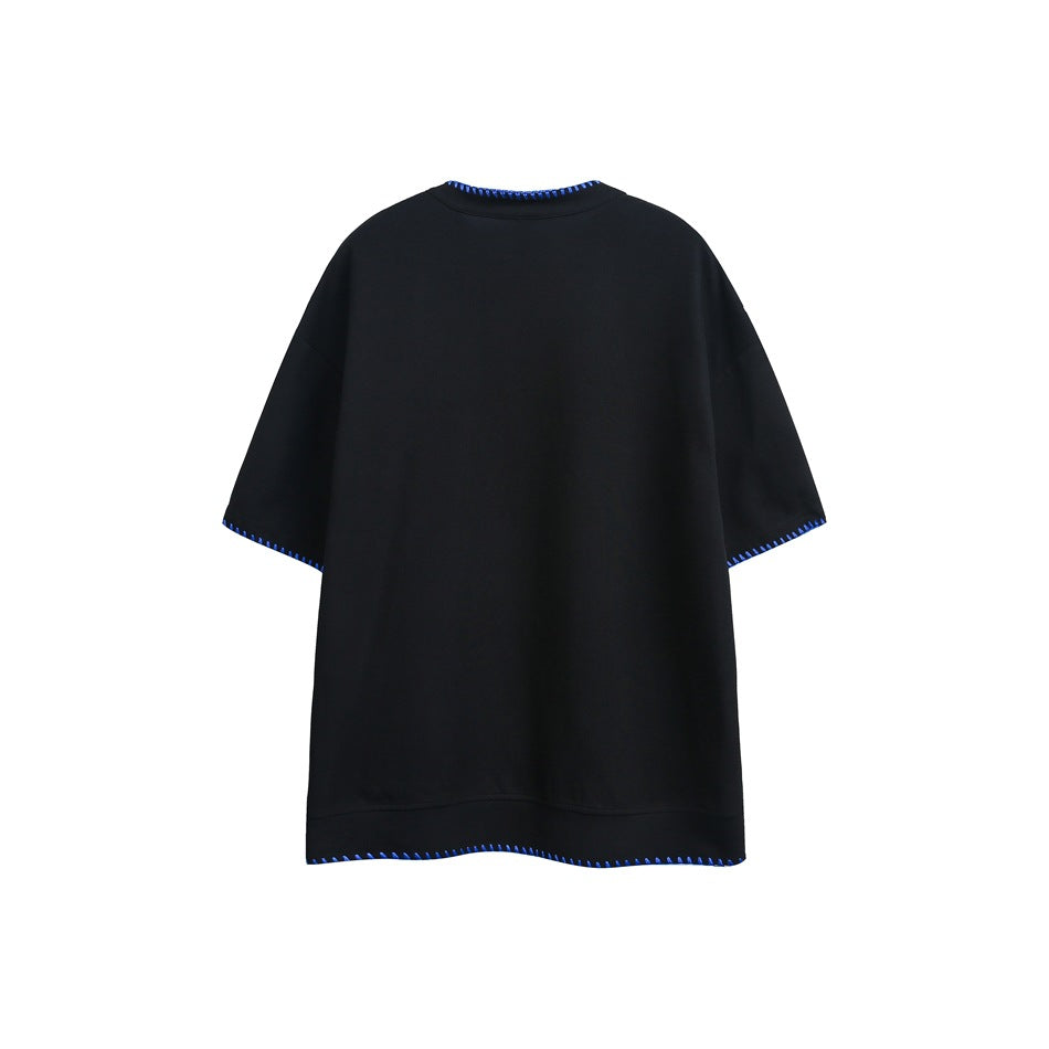 Back view of a black short-sleeve shirt with bright blue contrast stitching at the collar, cuffs and hem.