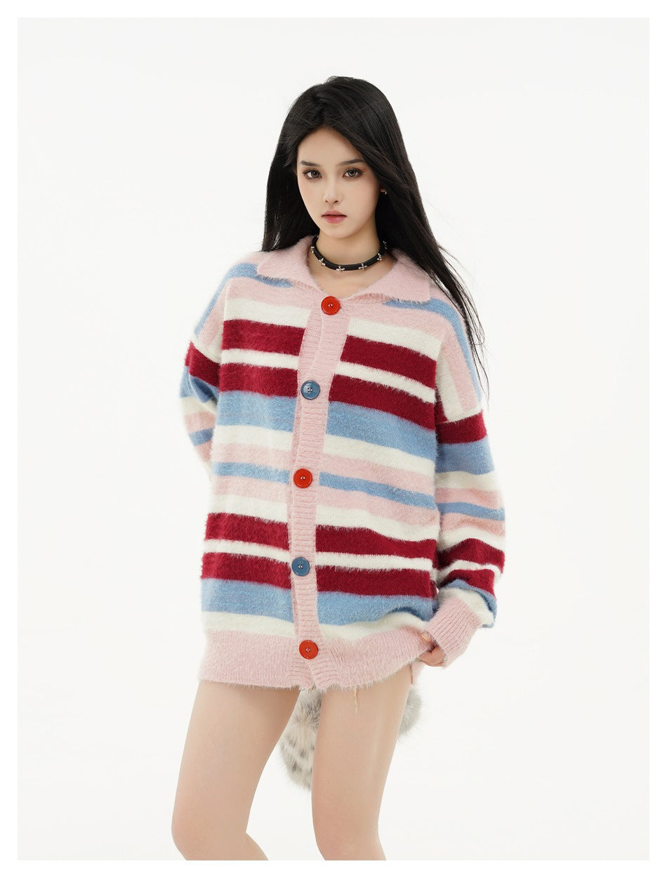 Model wearing a pink, blue, burgundy, and cream striped button-front cardigan, shown from the front.
