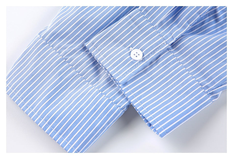 Close-up of a blue-and-white striped shirt cuff with a white button and stitched placket.