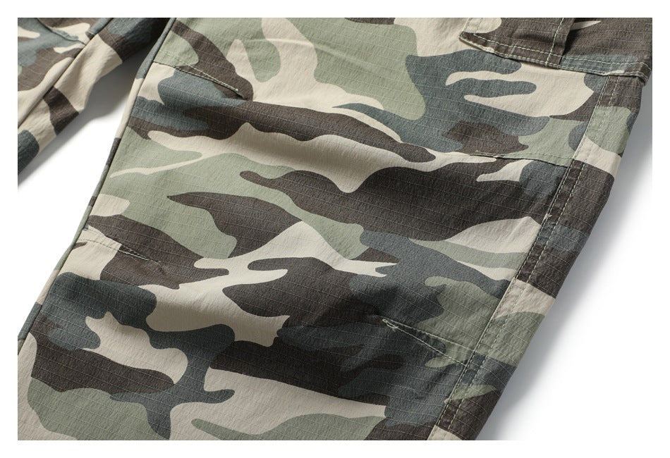 Close-up of a camouflage cargo-trouser leg with a large stitched pocket.