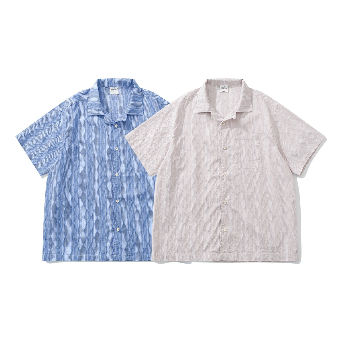 Two short-sleeve button-up shirts displayed flat: one blue striped and one pale pink striped.