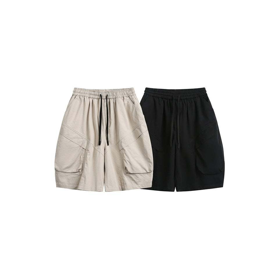 Front view of relaxed shorts in beige and black, each with an elastic waist, drawstring, and large cargo pockets.