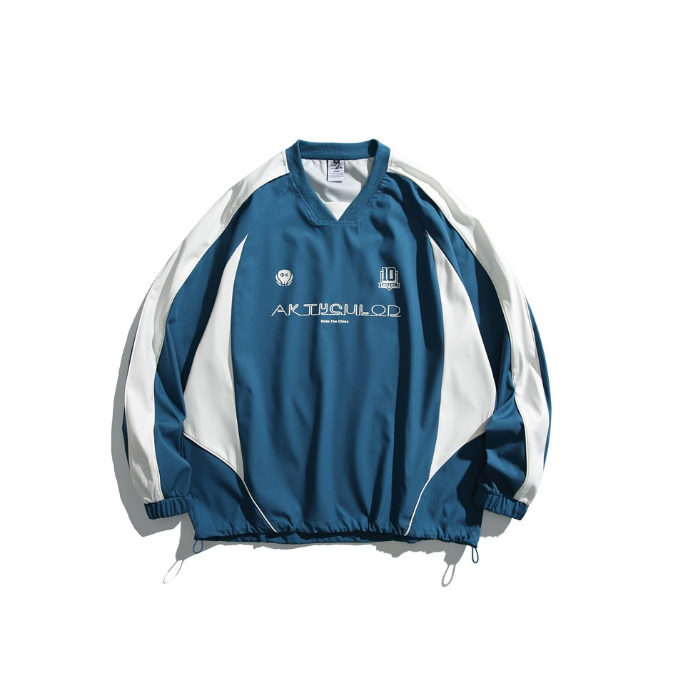 Blue V-neck raglan pullover with white side and sleeve panels, chest print and drawcord hem, flat lay