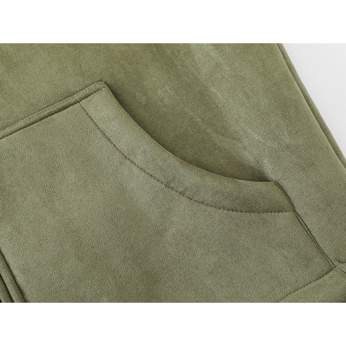 Close-up of an olive-green vest's large curved lower pocket and stitched edge.