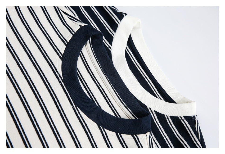 Close-up of striped shirt necklines with contrasting navy and white ribbed collars.