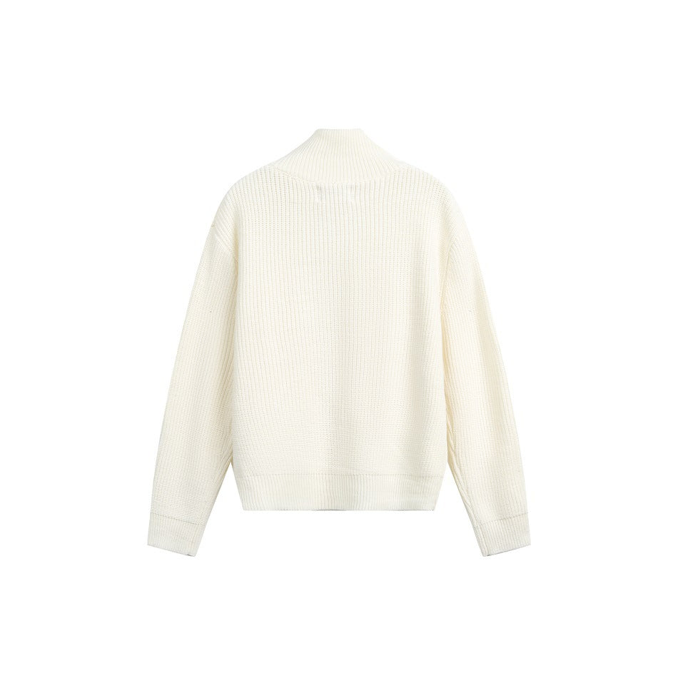 Back view of an ivory rib-knit sweater with a high collar, long sleeves and ribbed cuffs and hem.