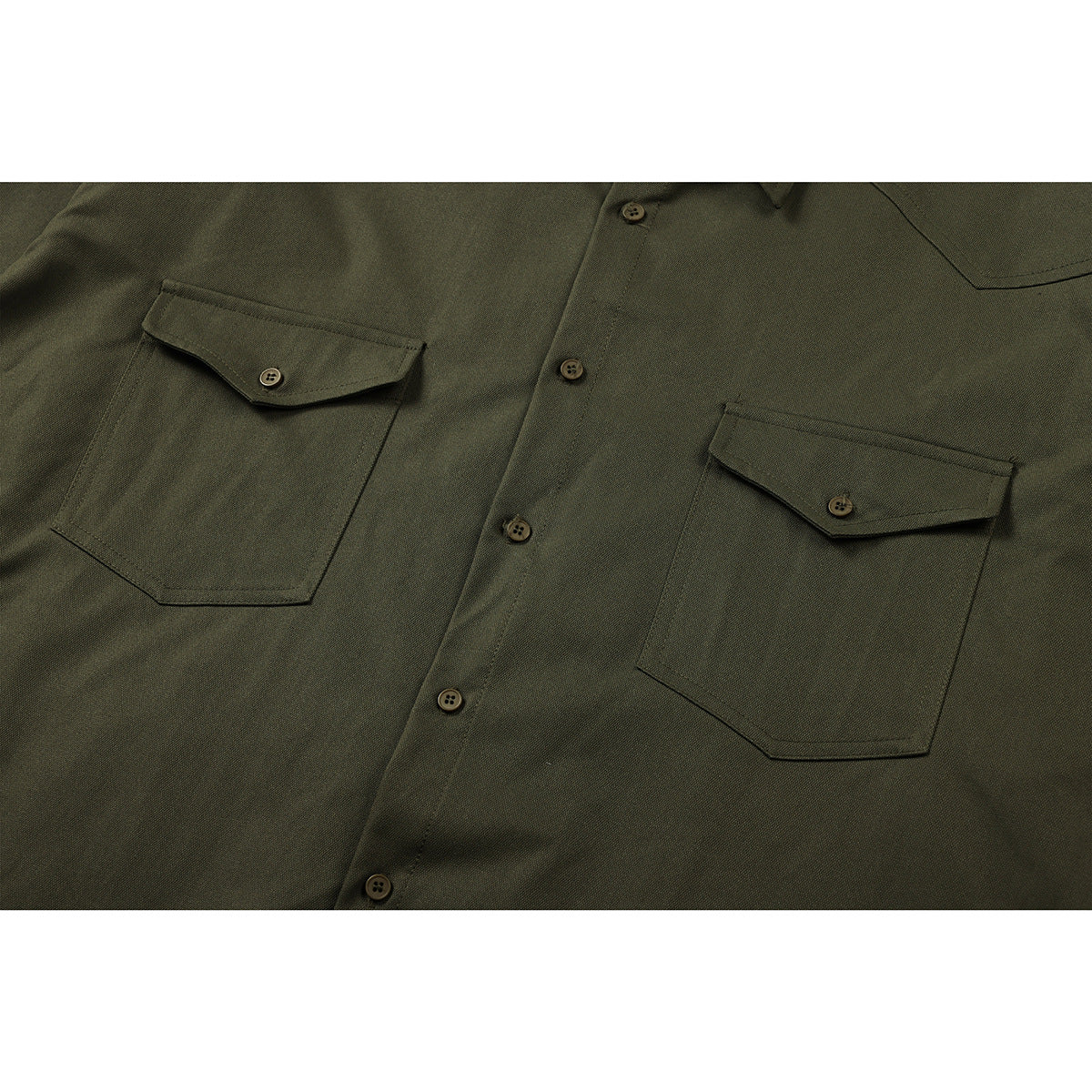Close-up of a dark olive button-front shirt with two flap chest pockets.